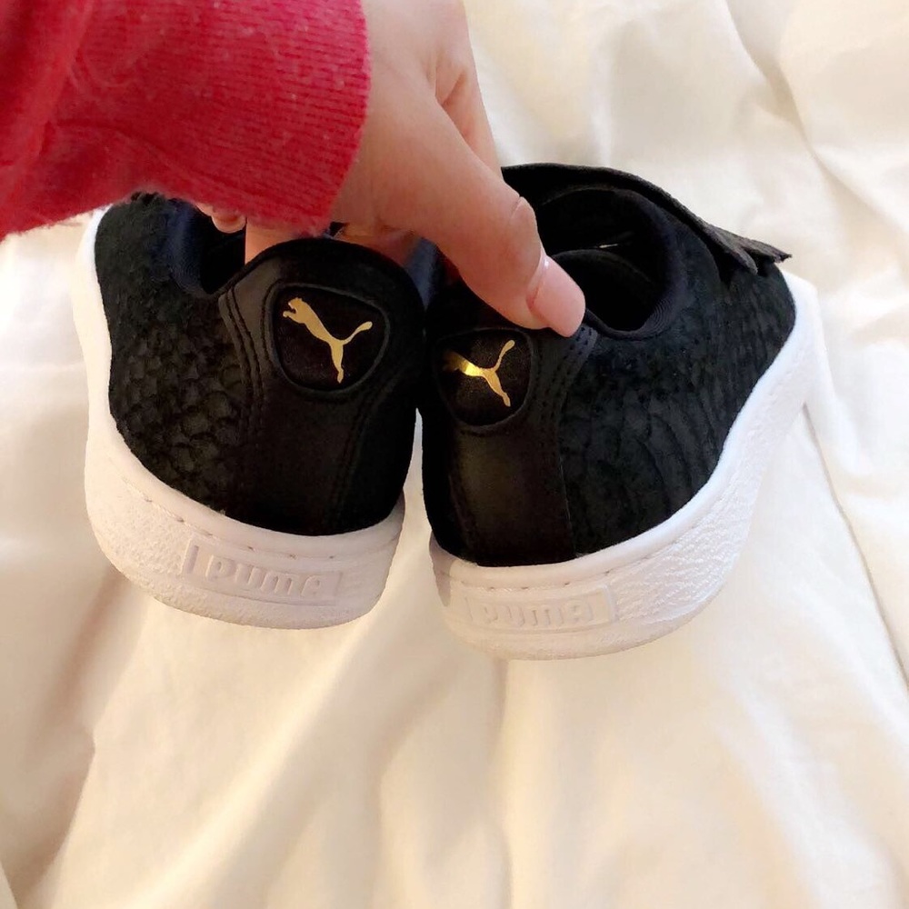 Black and gold puma sneakers